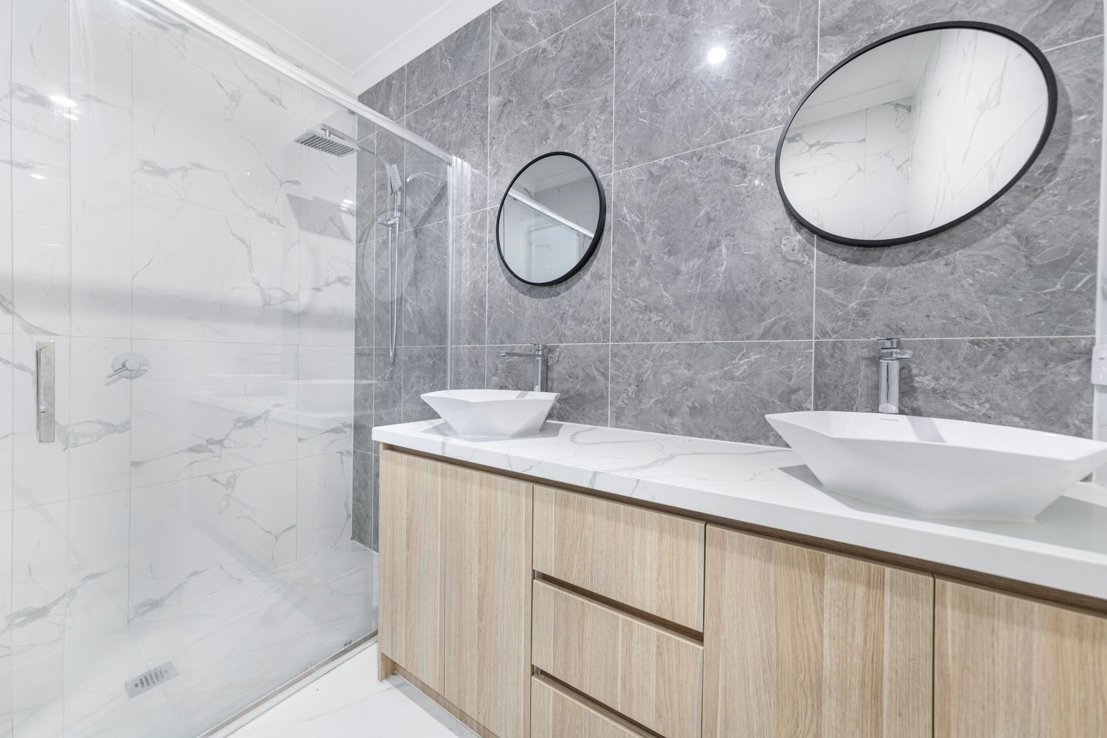 Renovated bathroom in New Lambton with floor-to-ceiling tiles and a walk-in shower